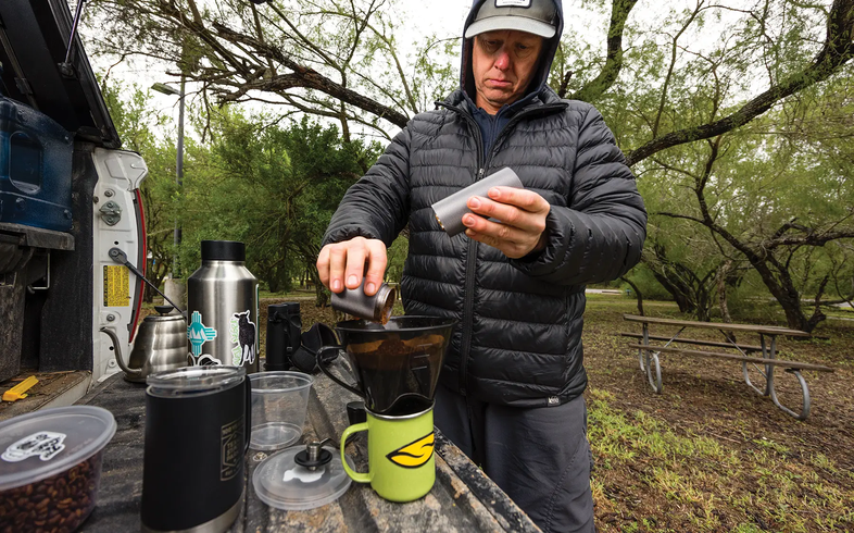 man making coffe at a state park