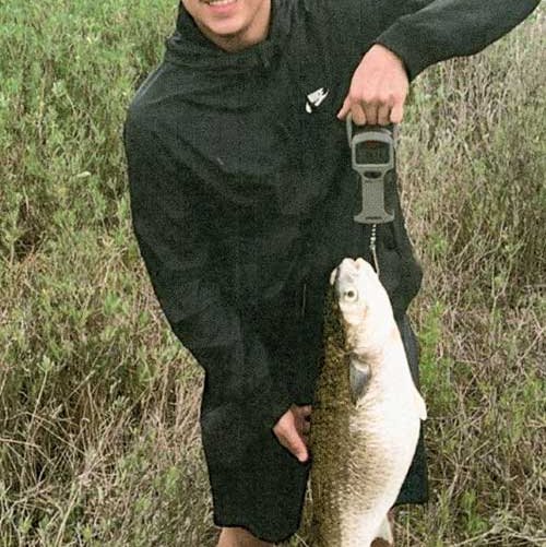 Thomas Valadez holds his striped mullet