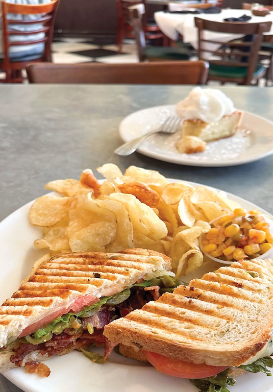 waxahachie restaraunt with a sandwich and chips on a plate and a plate with pie