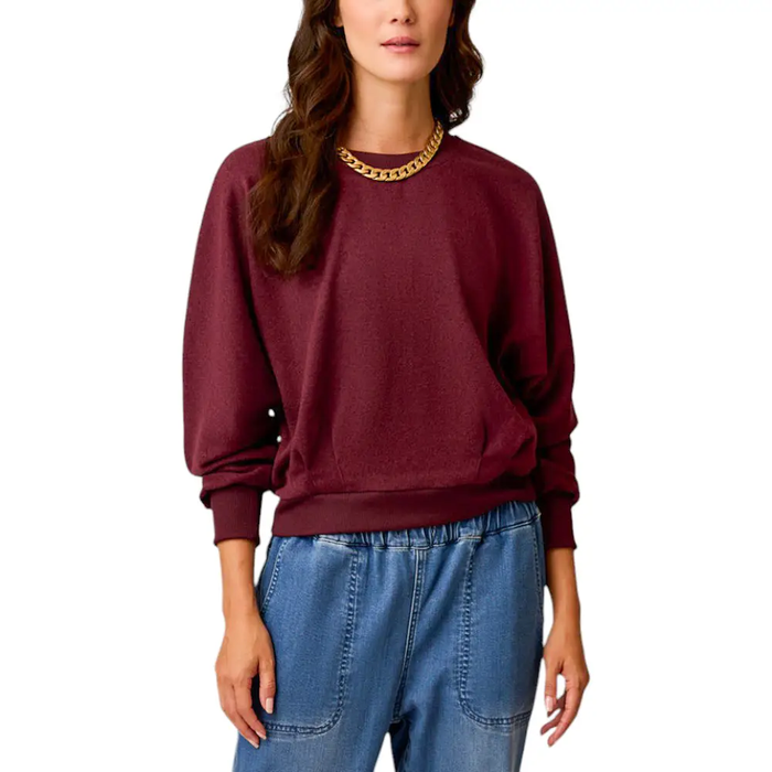 A woman wearing a Carve Designs shirt.