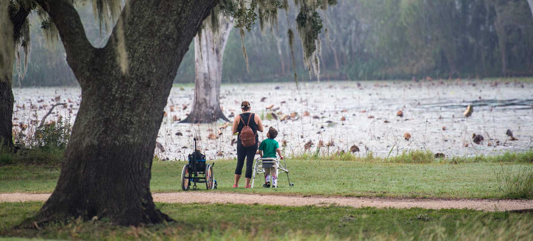 family by the lake at Brazos Bend state park
